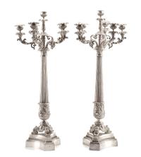 A Pair of French Silvered Bronze Six-Light Candelabra, 19th Century, each tapering stem of columnar form with acanthus leaves, raised o