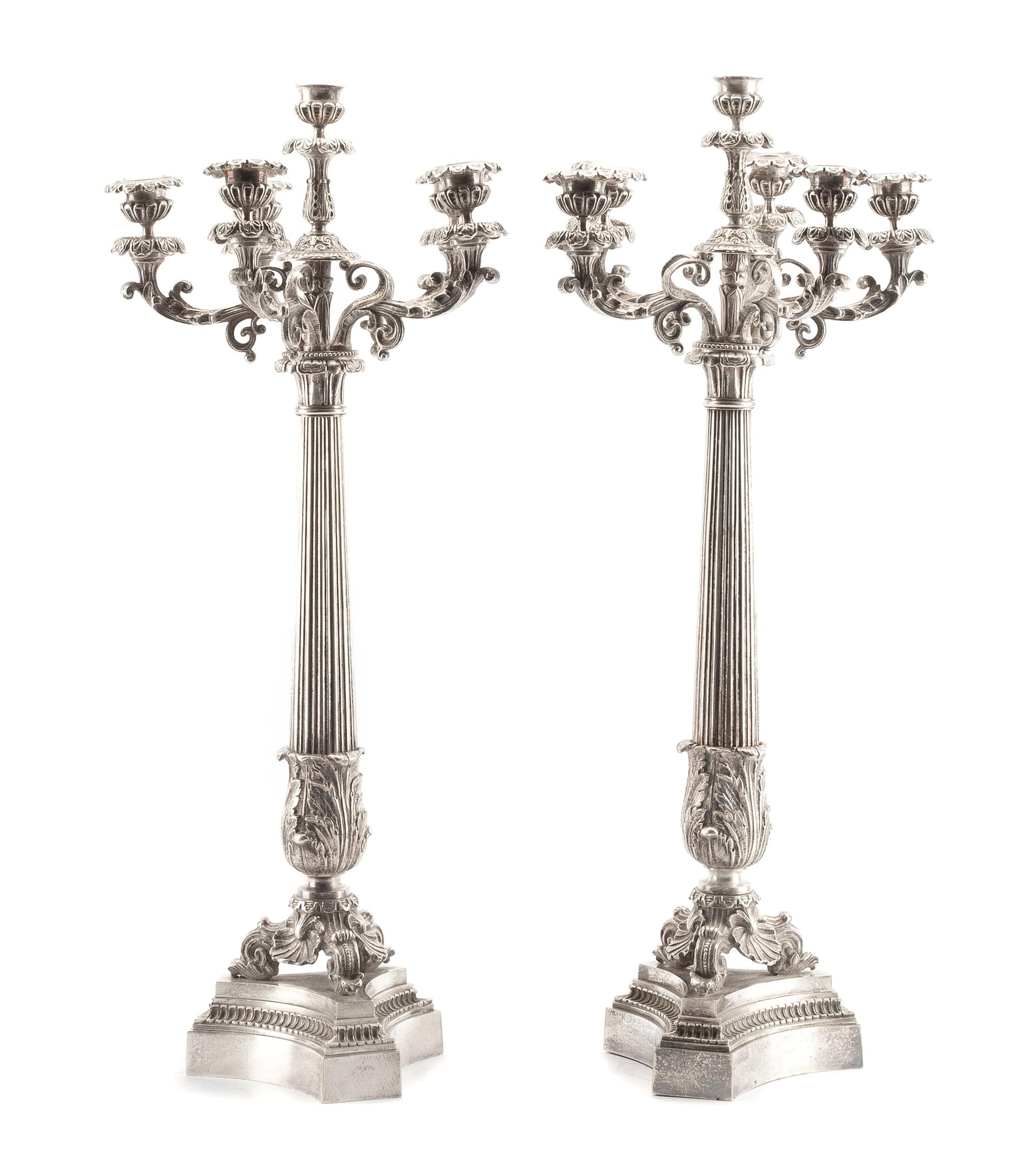 A Pair of French Silvered Bronze Six-Light Candelabra, 19th Century, each tapering stem of columnar form with acanthus leaves, raised o