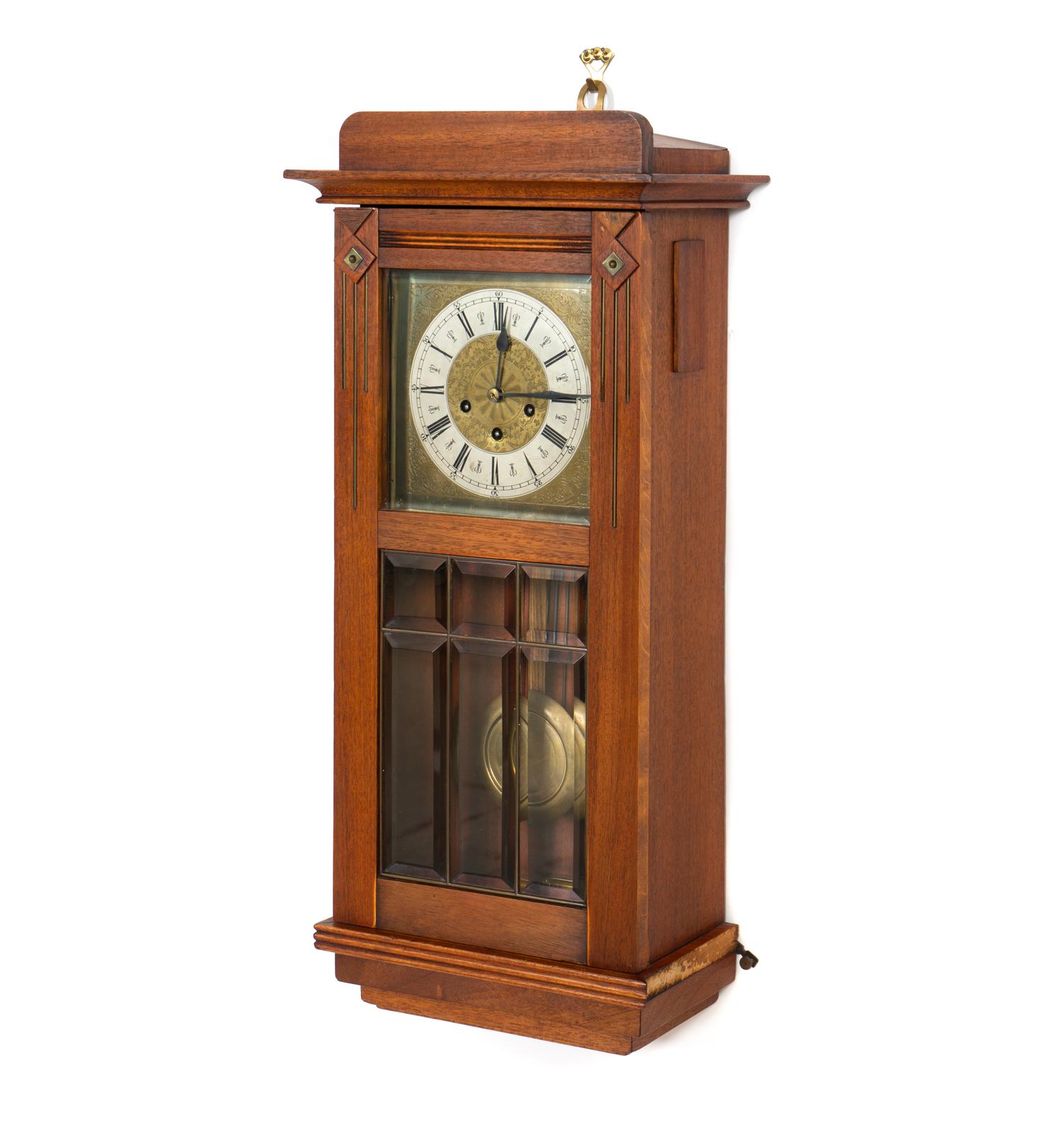 An Arts and Crafts Mahogany and Leaded Glass Wall Clock