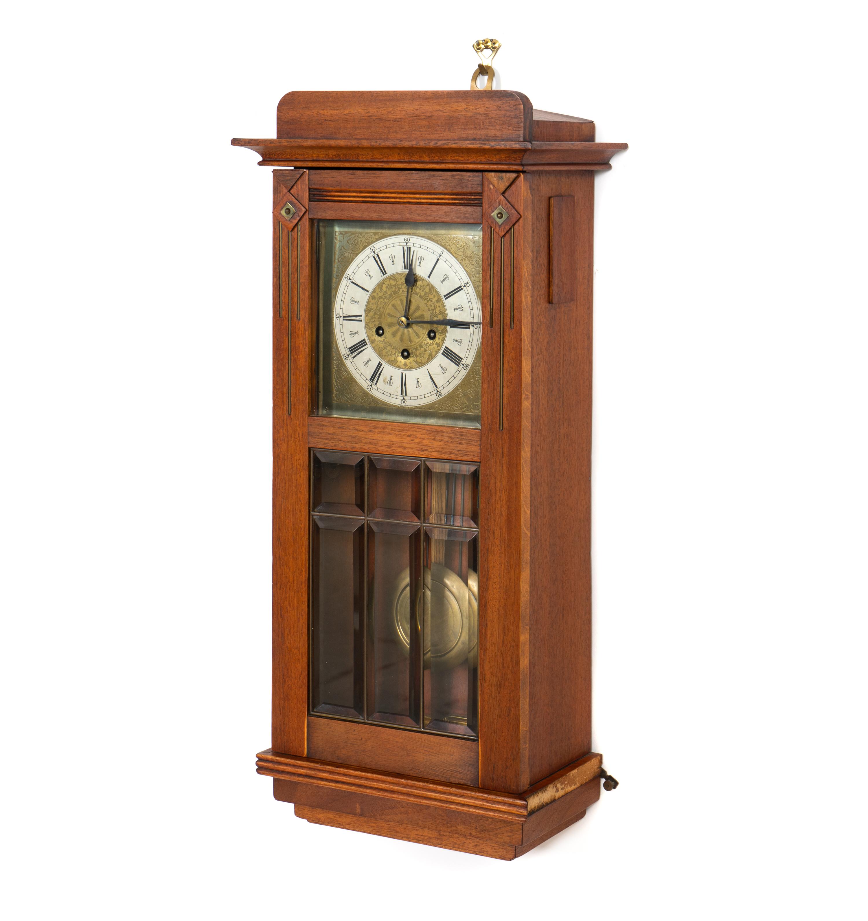 An Arts and Crafts Mahogany and Leaded Glass Wall Clock