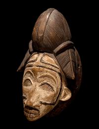 Four Punu Wood Masks