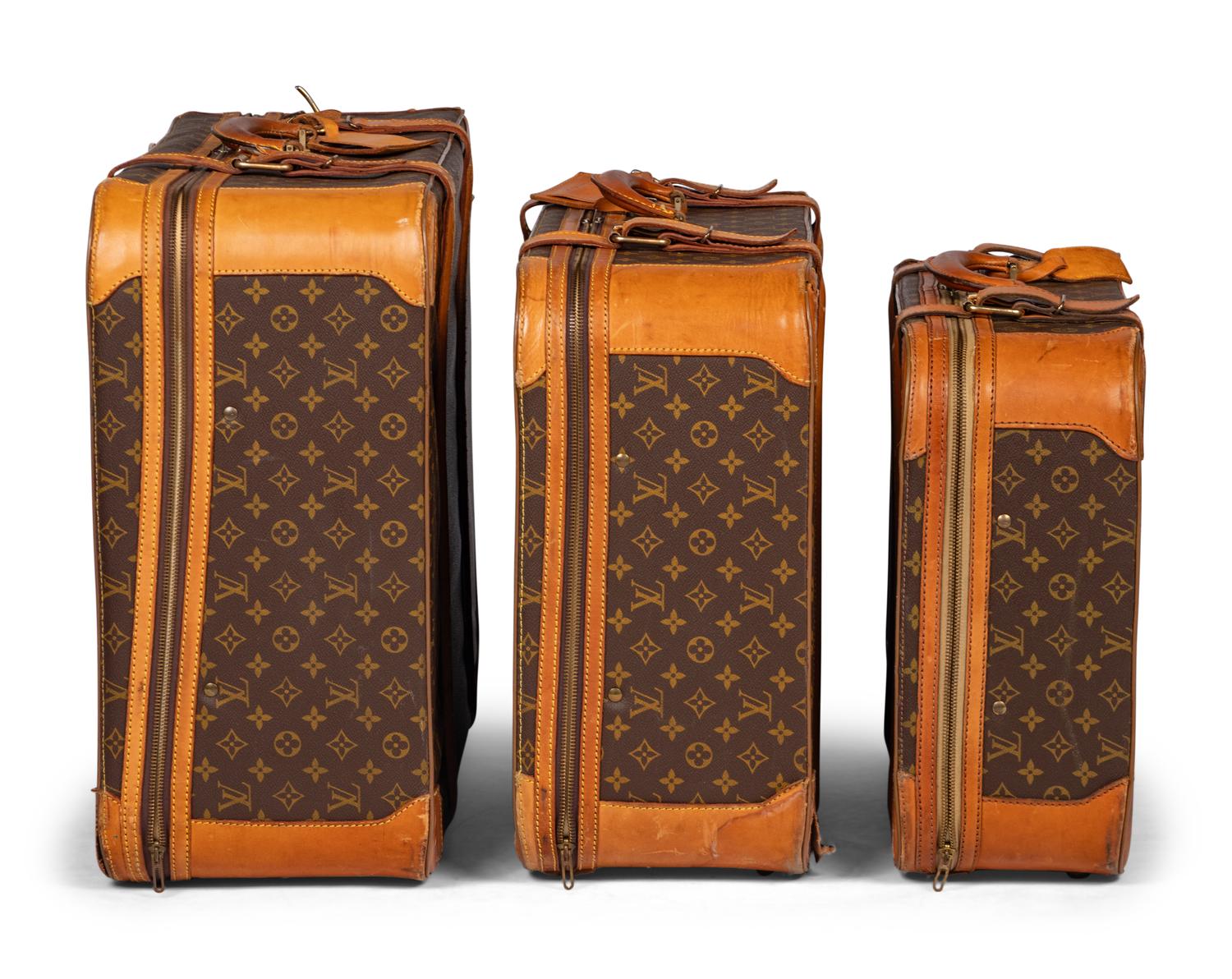 A Group of Three Louis Vuitton Soft-Sided Suitcases, 20th Century