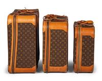 A Group of Three Louis Vuitton Soft-Sided Suitcases, 20th Century