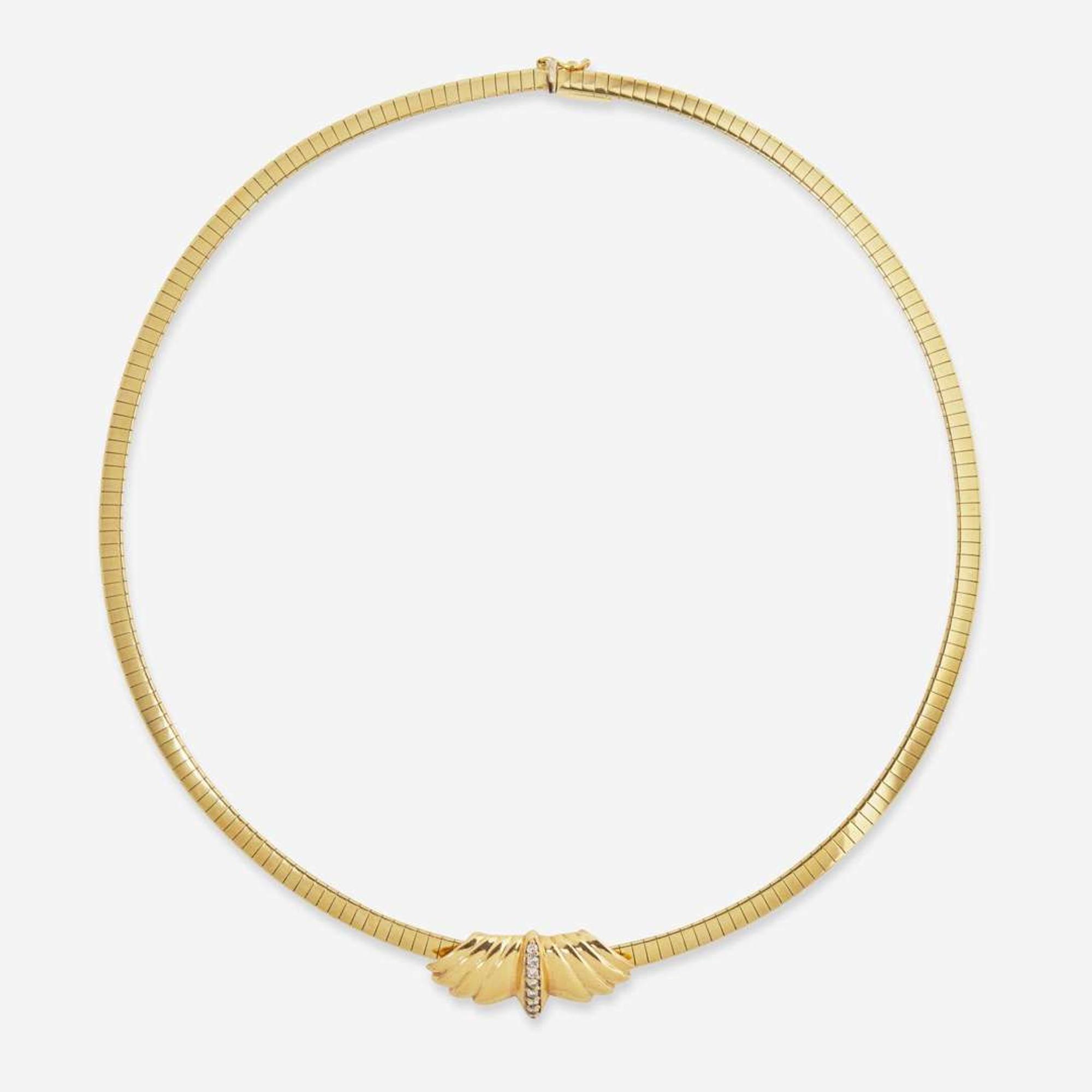 A 14K Yellow Gold Omega Chain and Slider Charms