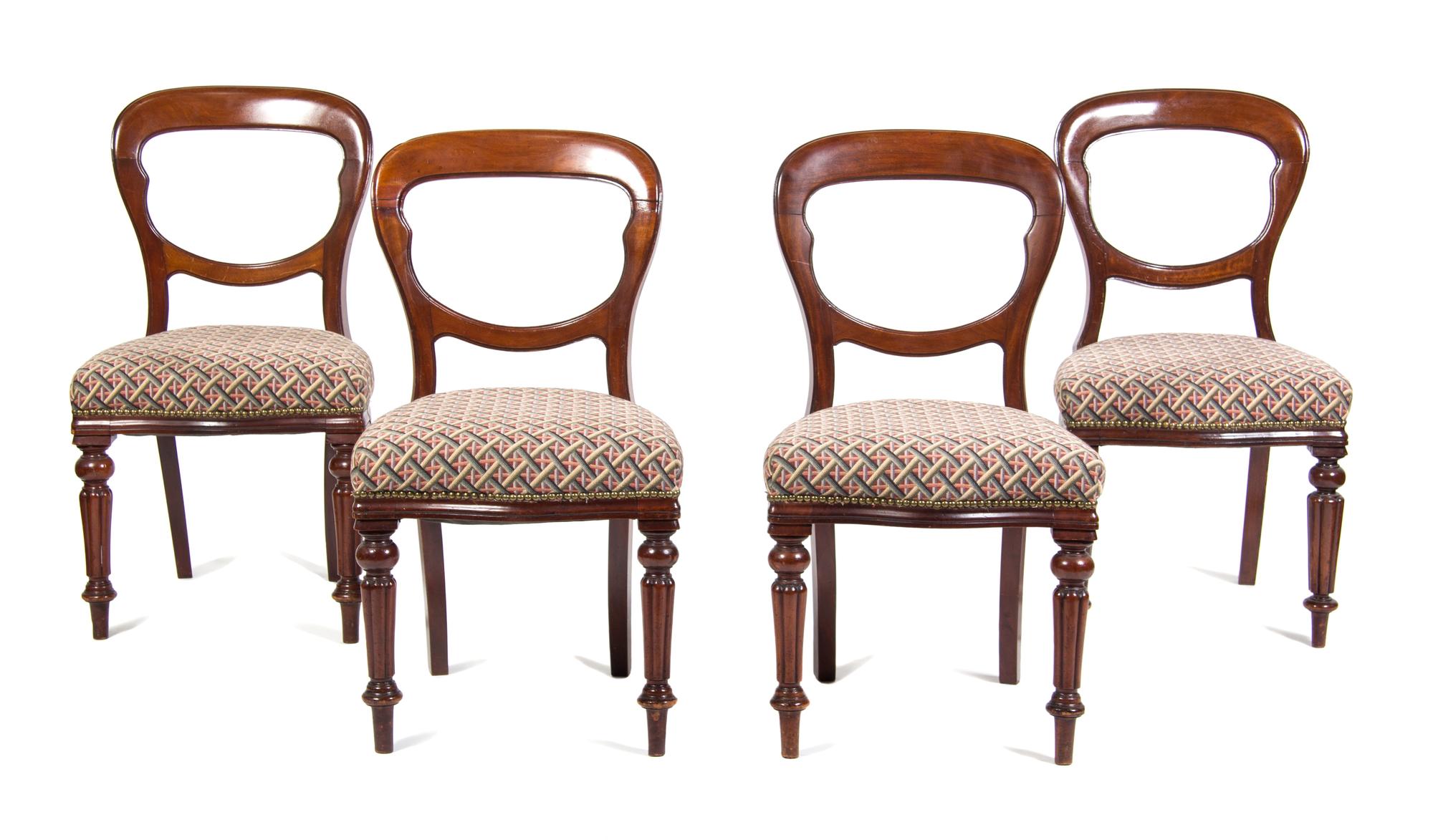 A Set of Four Victorian Walnut Side Chairs Height 34 1/2 inches.