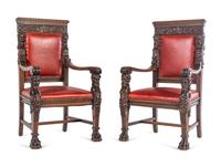A Set of Eight R.J. Horner Carved Oak Man of the Mountain Dining Chairs