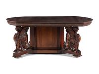 A Renaissance Revival Carved Mahogany Dining Table and Set of Six Chairs