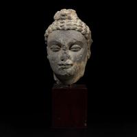 A carved schist head of a Buddha, Gandhara 健陀罗片岩佛首 3rd - 5th Century or earlier ????????