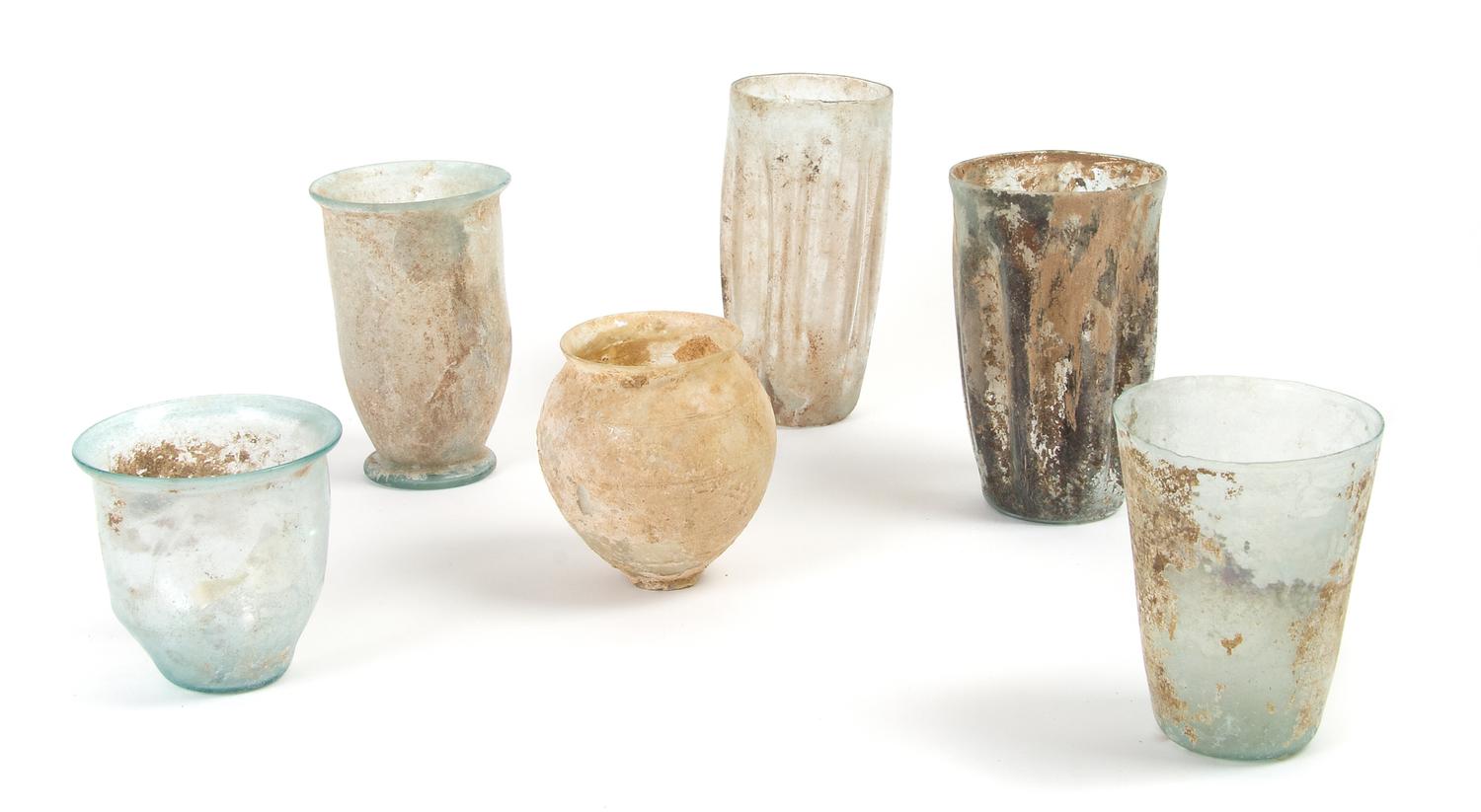 A Collection of Roman Glass Beakers and Cups, Height of tallest 5 inches.
