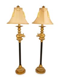 A Pair of Empire Style Ebonized and Gilt Metal Elephant Candlesticks now Mounted as Lamps — 20TH CENTURY