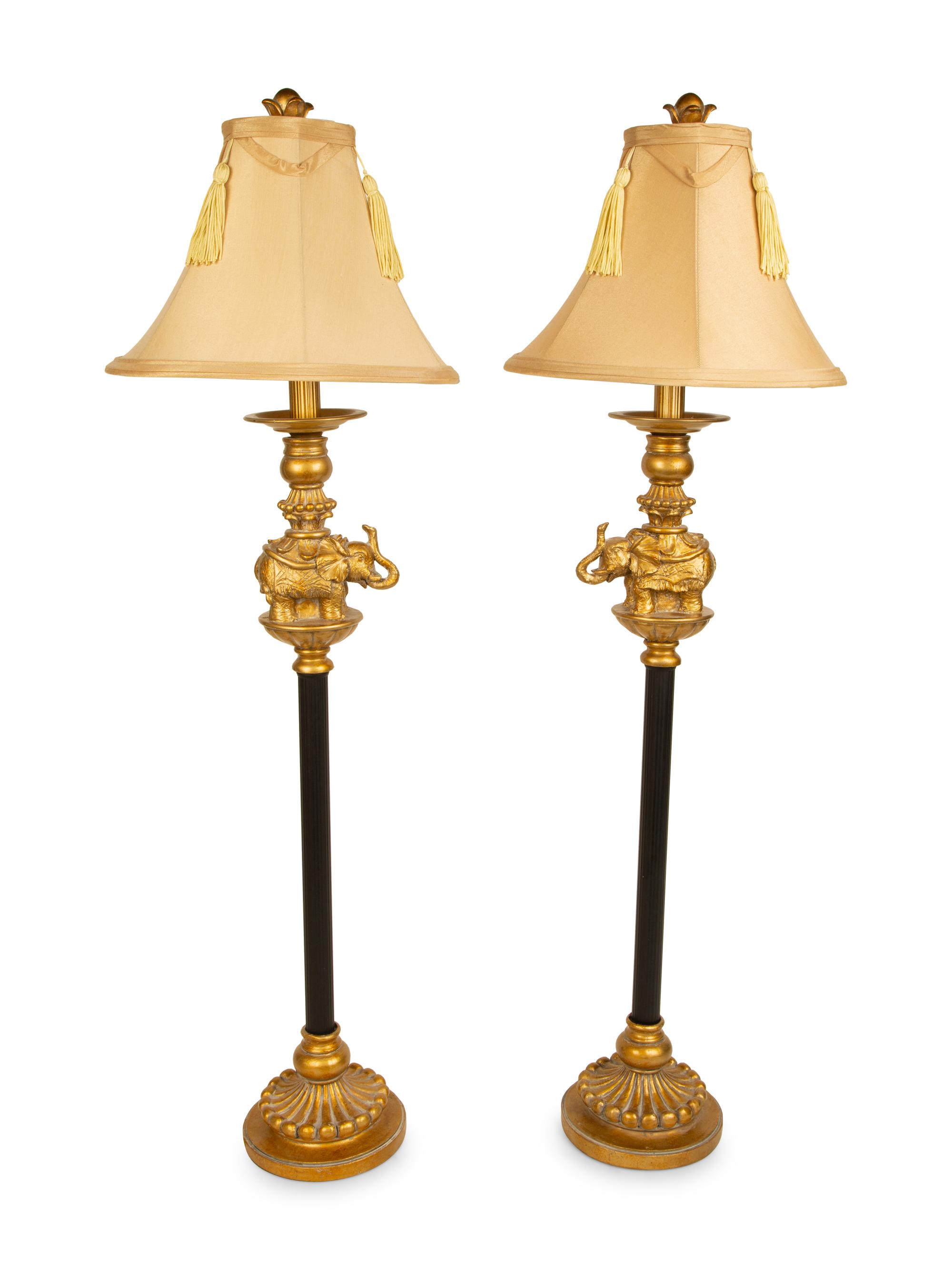 A Pair of Empire Style Ebonized and Gilt Metal Elephant Candlesticks now Mounted as Lamps — 20TH CENTURY