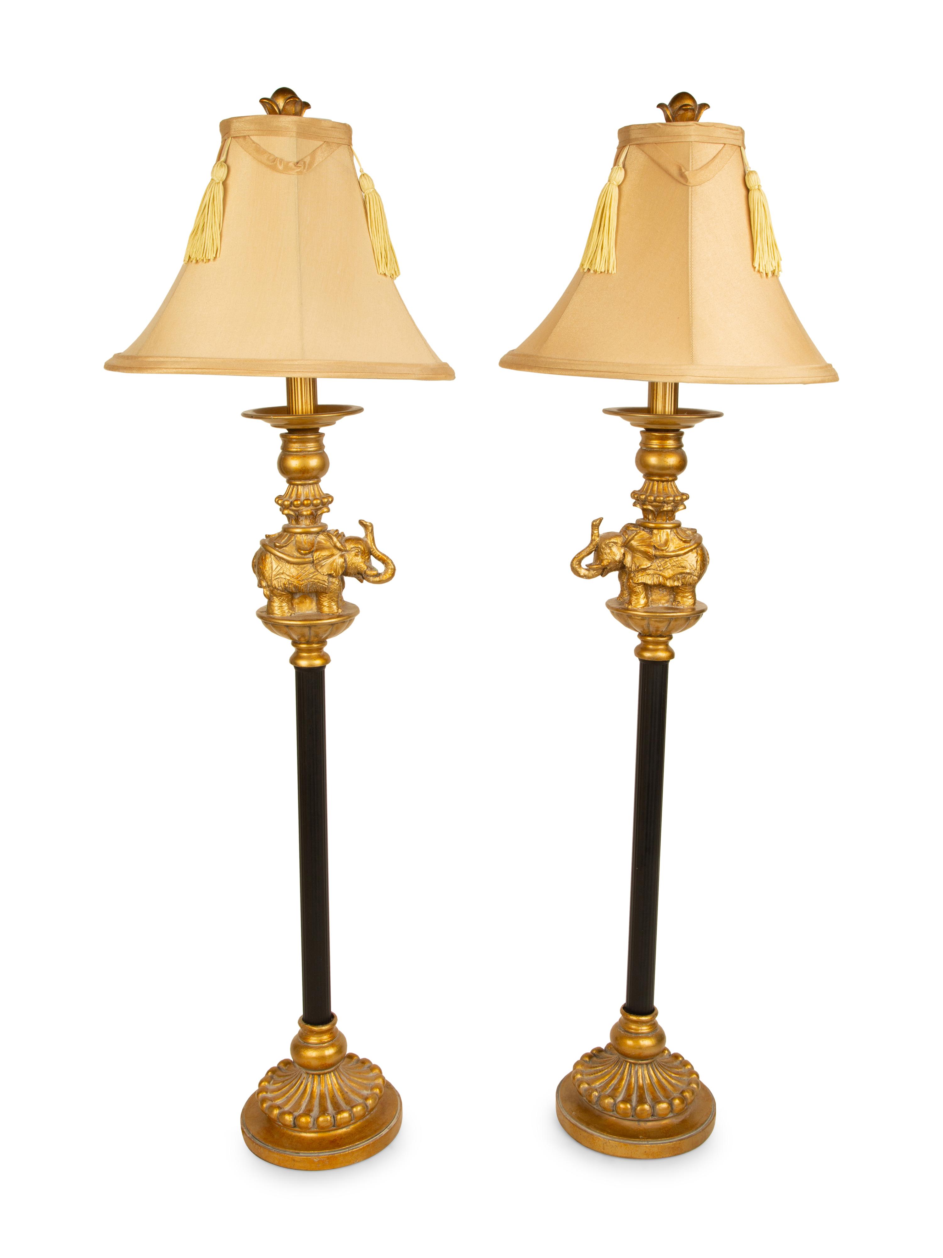 A Pair of Empire Style Ebonized and Gilt Metal Elephant Candlesticks now Mounted as Lamps — 20TH CENTURY