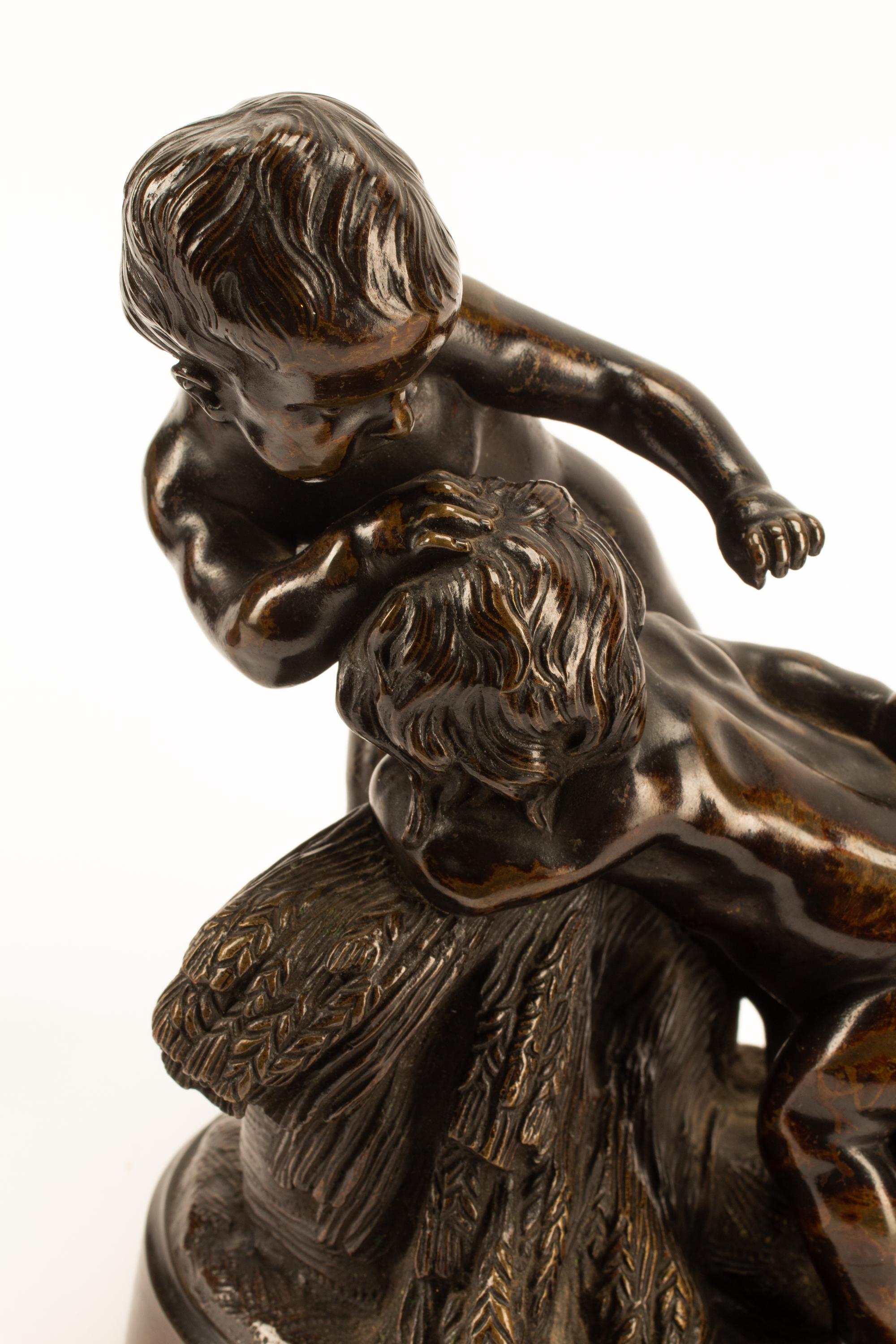 A Pair of French Patinated Bronze Figural Groups