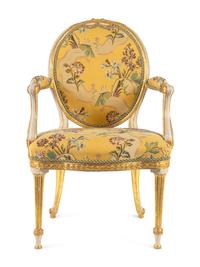 A George III White-Painted and Parcel-Gilt Open Armchair