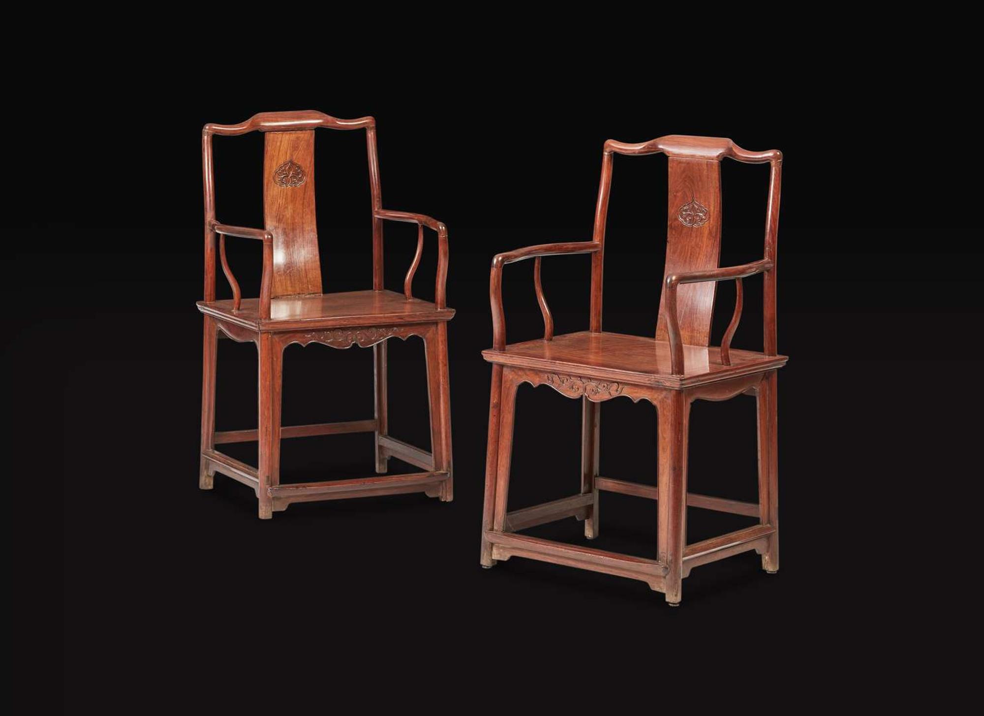 A pair of Chinese huanghuali continuous yoke-back armchairs, Nanguanmaoyi, Qing Dynasty 黃花梨南官帽椅一對 清