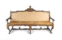 An Italian Early Rococo Parcel-Gilt and Painted Settee — POSSIBLY PORTUGUESE, SECOND QUARTER 18TH CENTURY