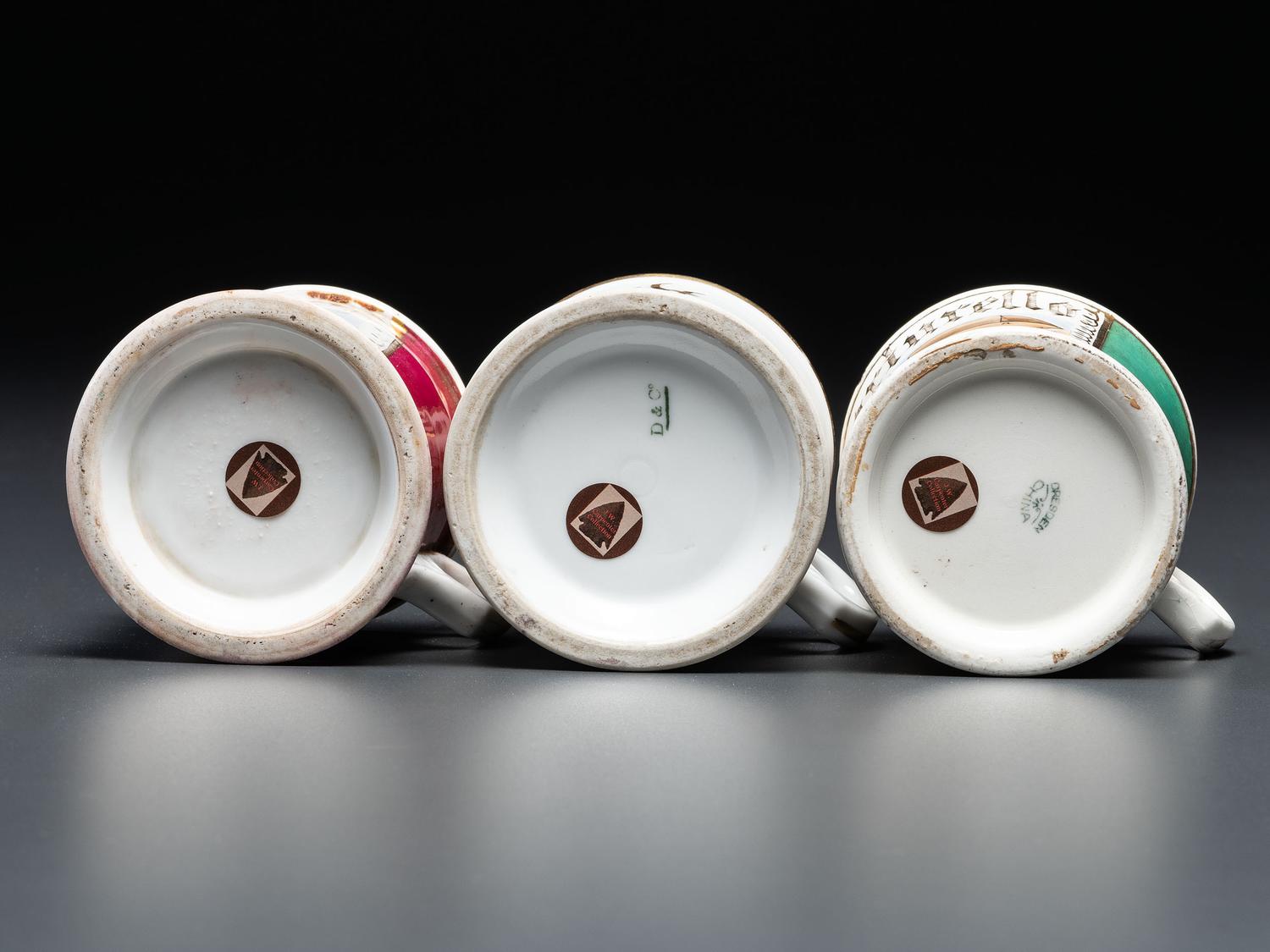 Three Porcelain Occupational Shaving Mugs with Horse-Drawn Carts