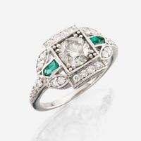 A diamond, emerald, and white gold ring
