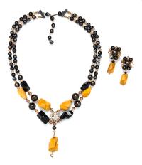 A Double Strand Bakelite Necklace and Earclips, Necklace 24", earclips 2" x 1".