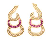 A Pair of 18 Karat Yellow Gold, Diamond and Ruby Earclips, 19.10 dwts.