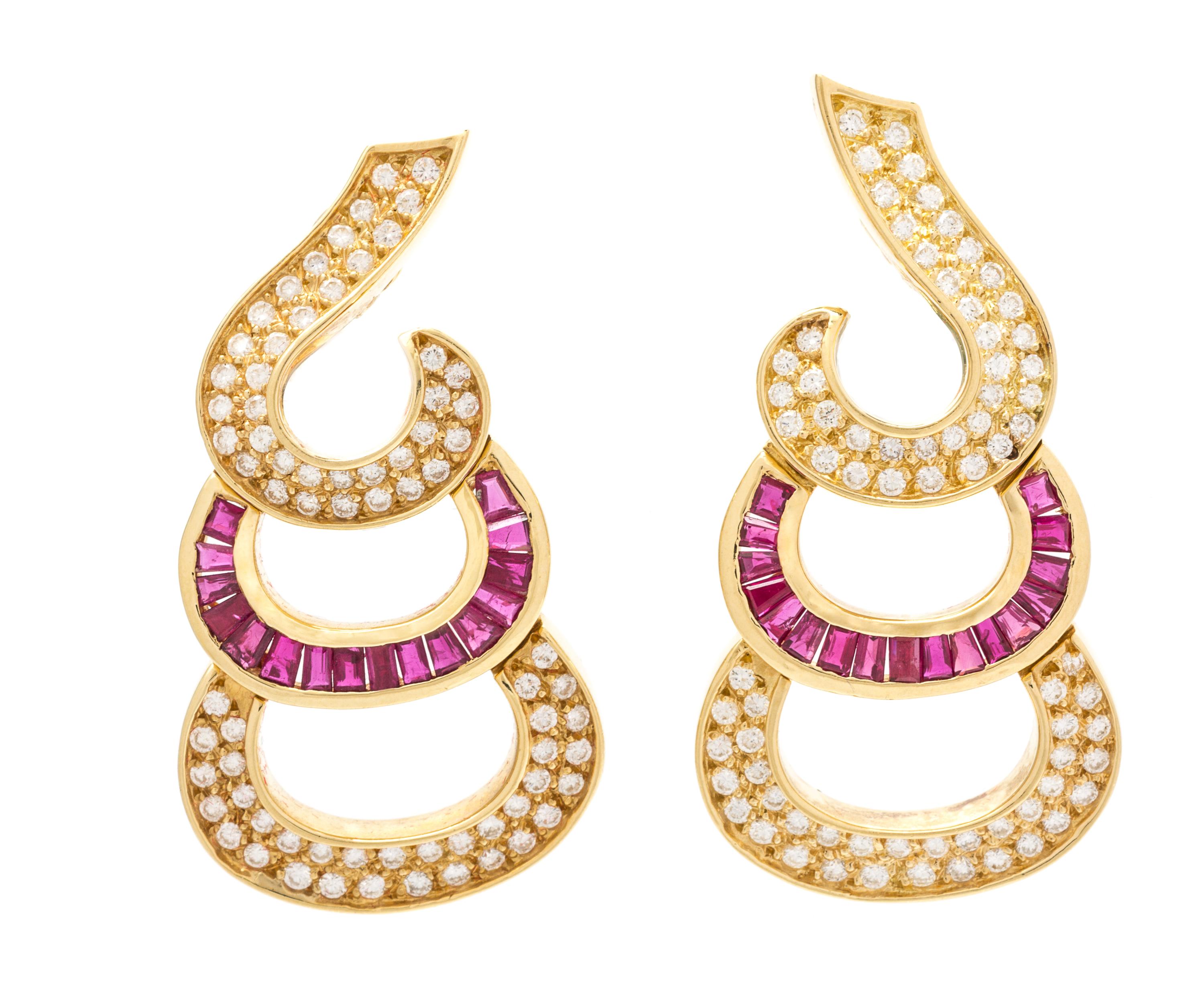 A Pair of 18 Karat Yellow Gold, Diamond and Ruby Earclips, 19.10 dwts.