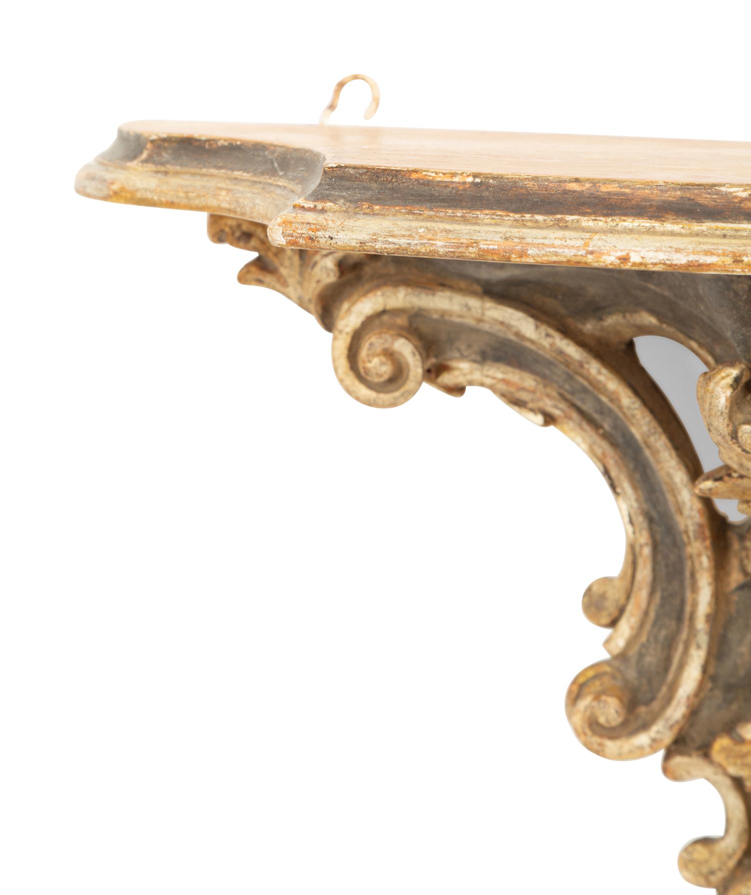 An Italian Rococo Style Carved and Painted Wall Bracket with Faux Marble Shelf