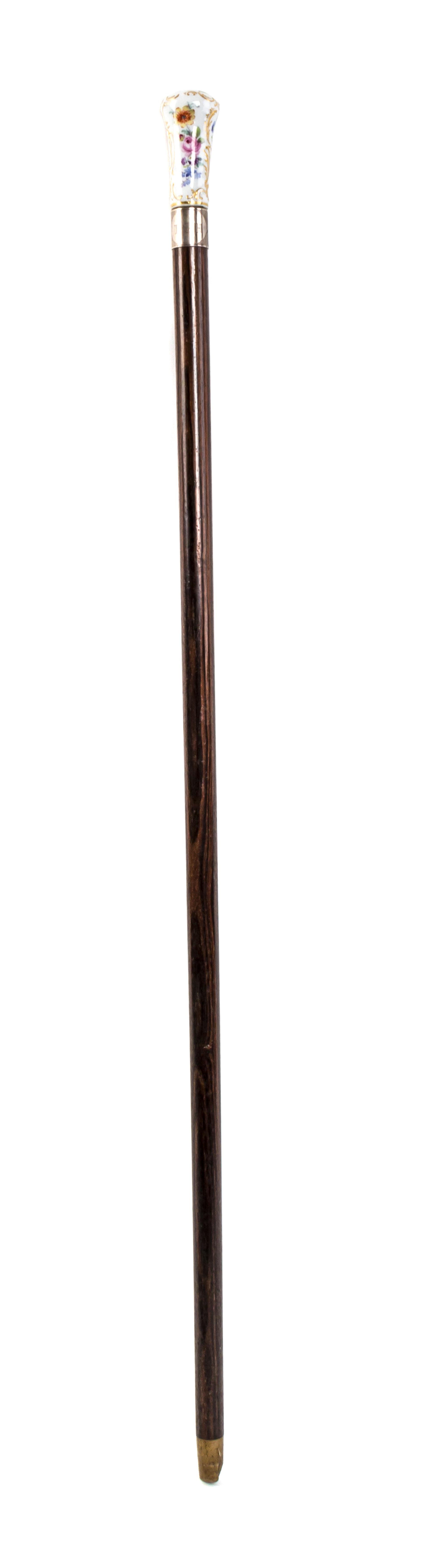 A Meissen Style Porcelain Handled Walking Stick, Length of handle 2 3/4 x length overall 31 1/2 inches.