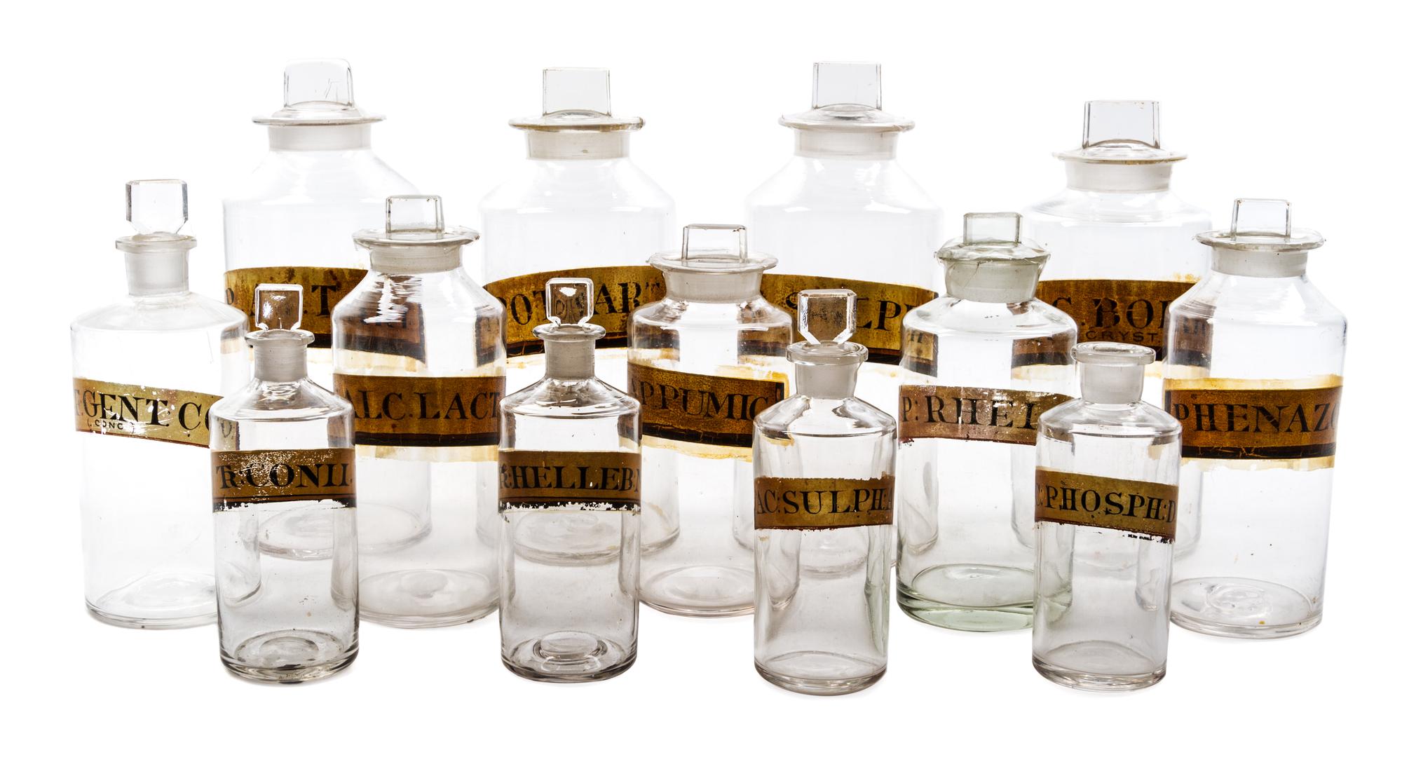 A Group of Thirteen Blown Glass Apothecary Bottles Height of tallest 10 inches.