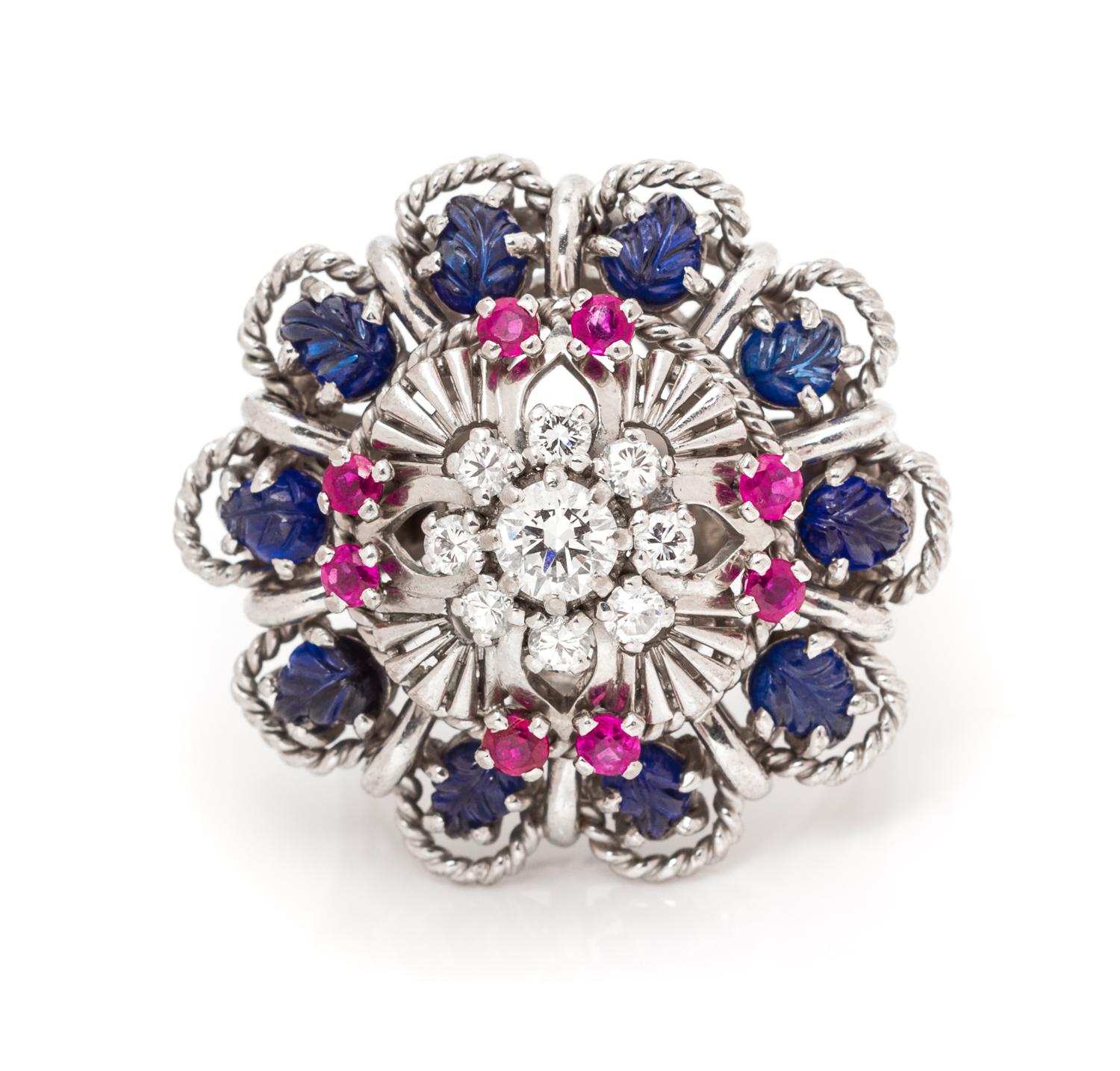 An 18 Karat White Gold, Sapphire, Ruby and Diamond Ring, 10.90 dwts.