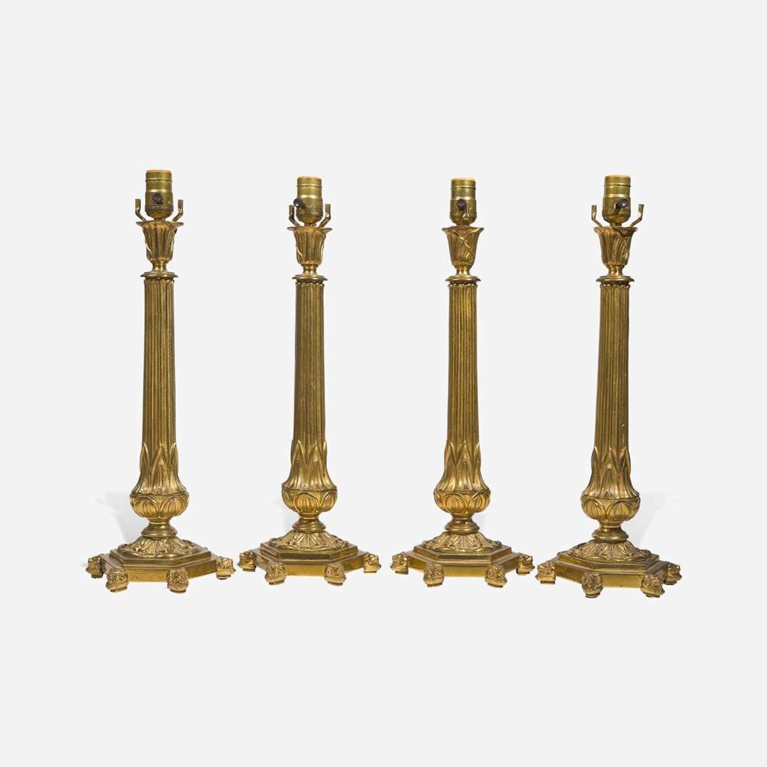 A set of four gilt bronze table lamps 20th century