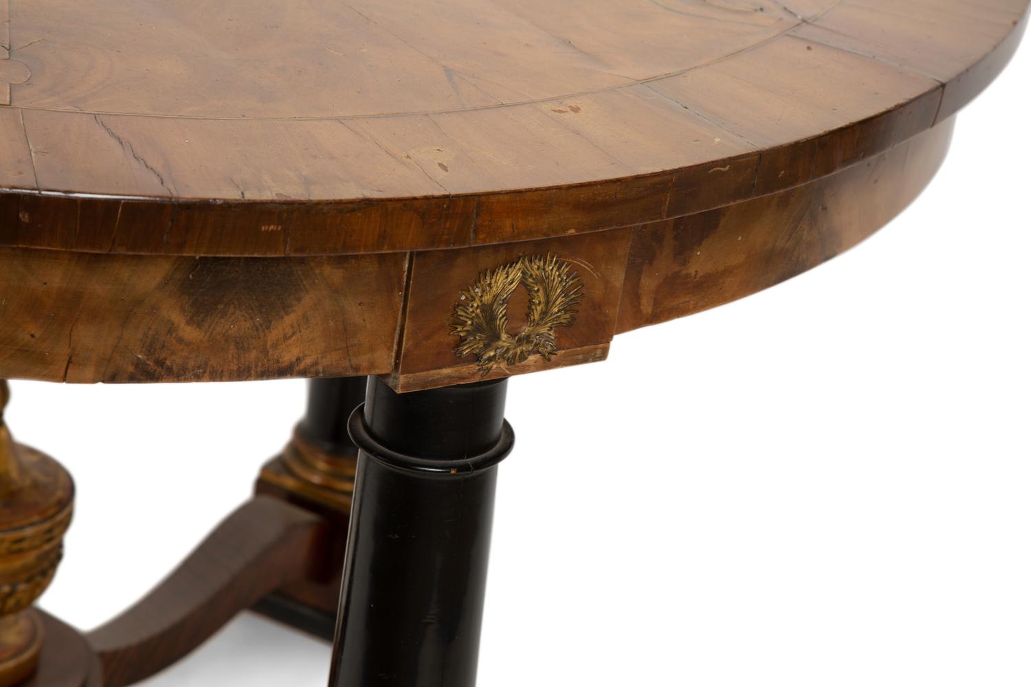 An Empire Style Parcel Ebonized Walnut Center Table — 19TH CENTURY