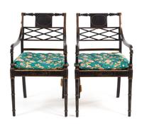 A Pair of Regency Style Parcel Gilt Ebonized Armchairs Height 36 1/4 inches. — 20TH CENTURY