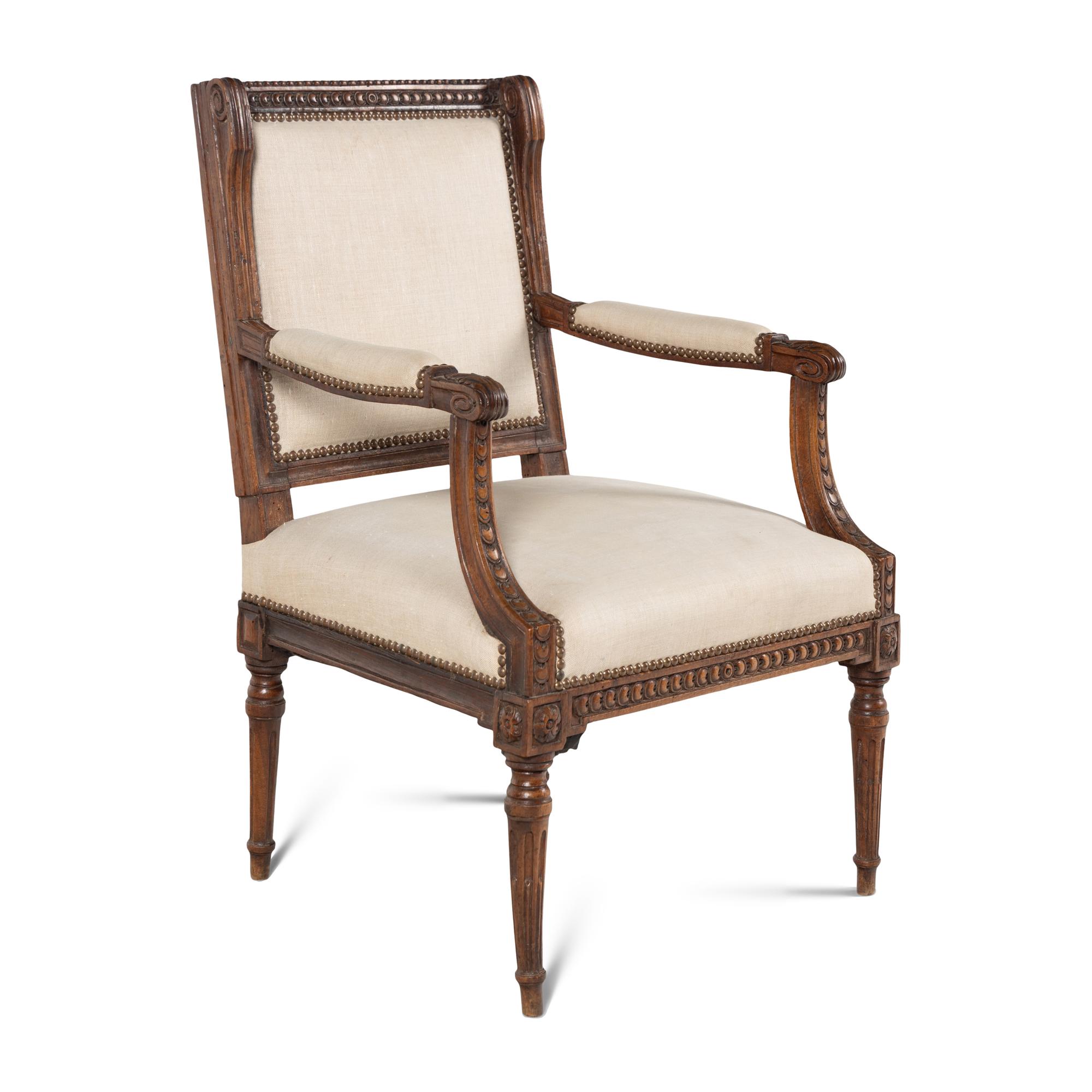 A Louis XVI Carved Walnut Fauteuil
