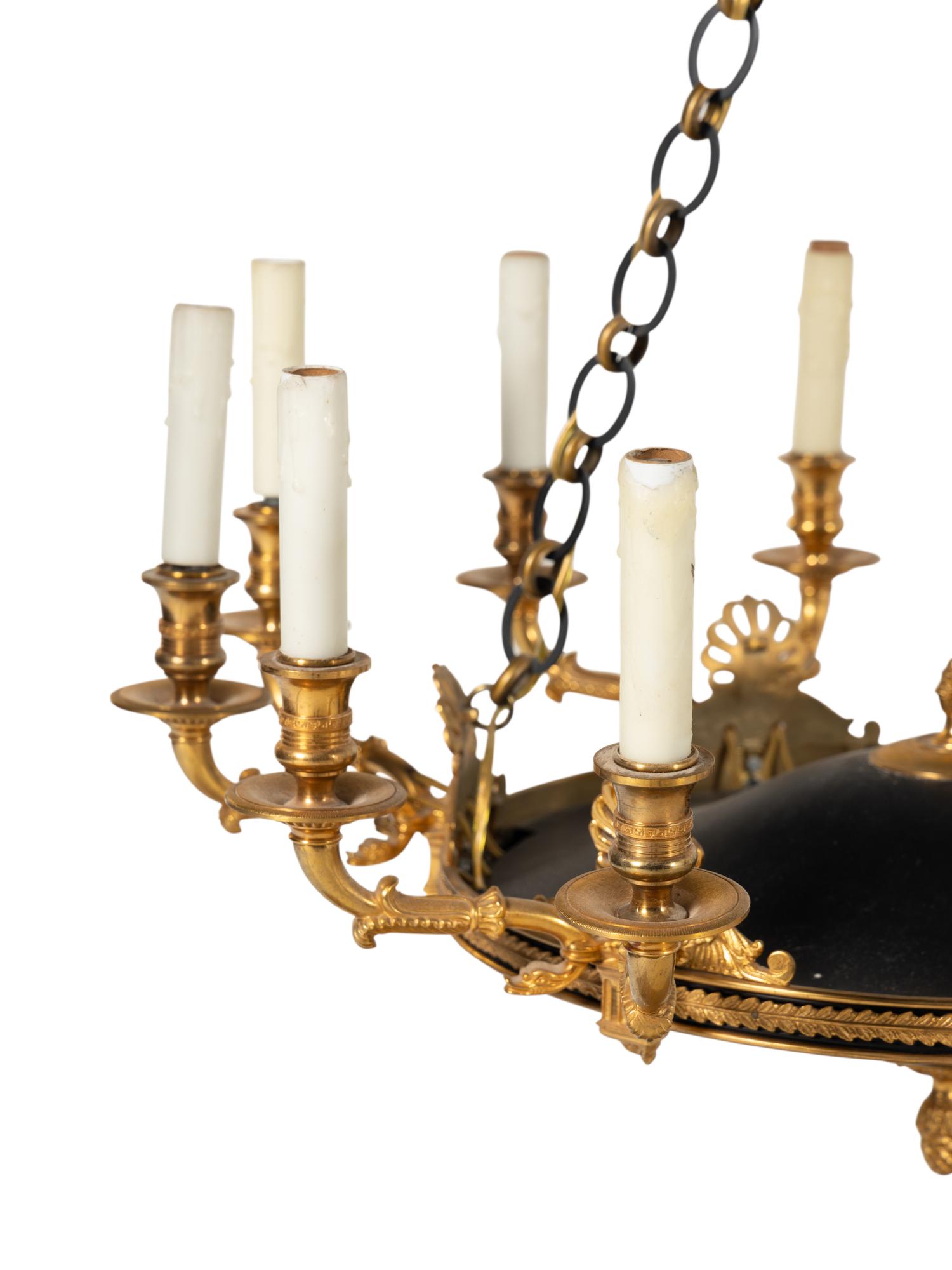 An Empire Style Gilt Bronze and Tole Ten-Light Chandelier