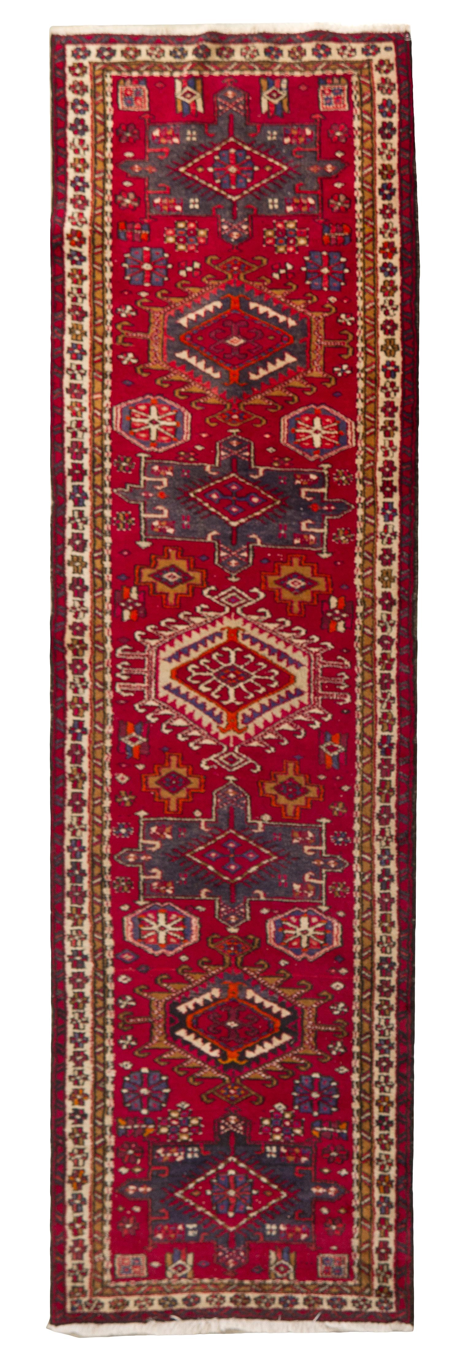 A Heriz Wool Runner, 11 feet 2 inches x 3 feet 4 inches.