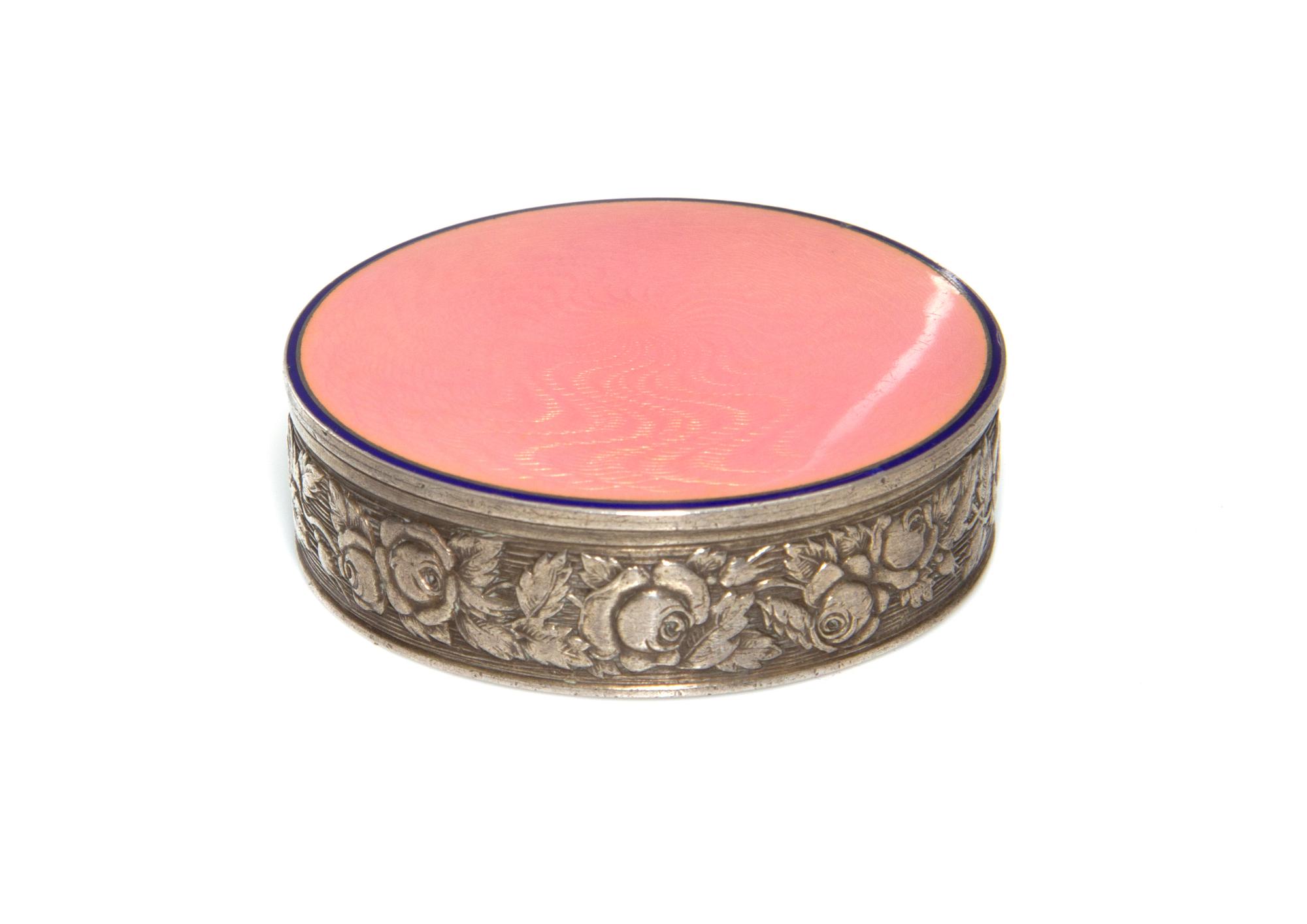 A Russian Guilloche Enameled Silver Compact, St. Petersburgh, 1996-1908, of circular form, the sides decorated with flowers in relief,