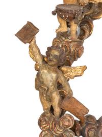 A Florentine Carved Giltwood and Silvered Wood Altarpiece with Musical Putti