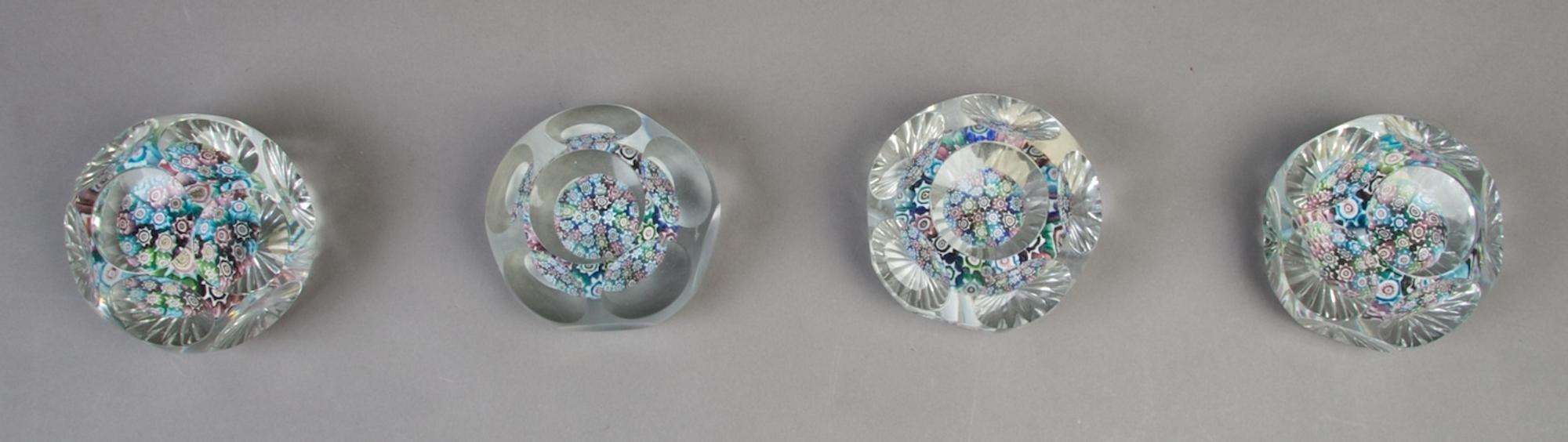 A Collection of Four Faceted Paperweights, Diameter 2 7/8 inches.