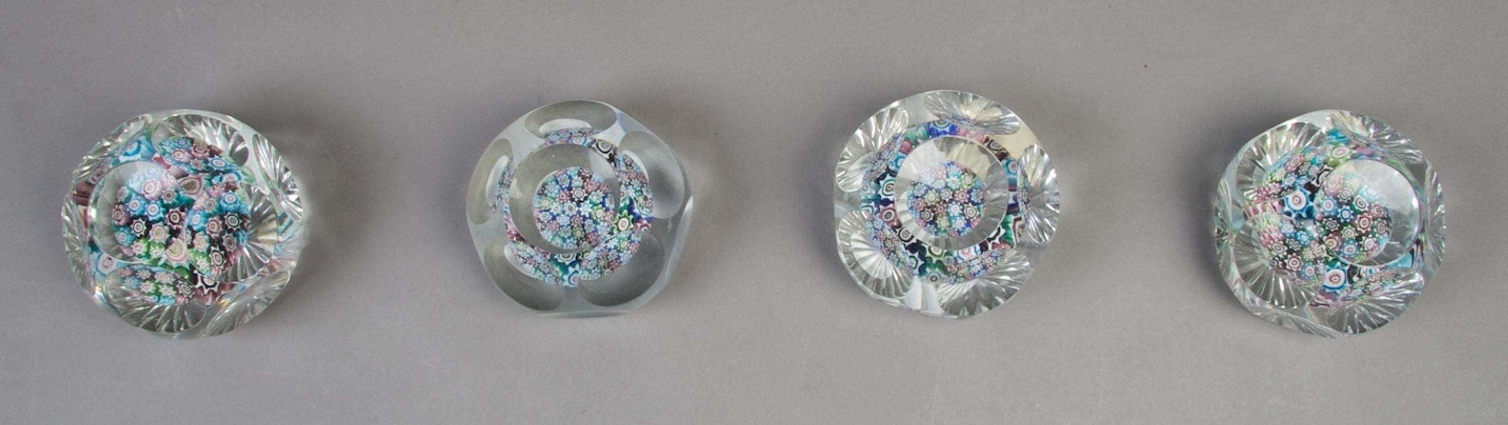 A Collection of Four Faceted Paperweights, Diameter 2 7/8 inches.