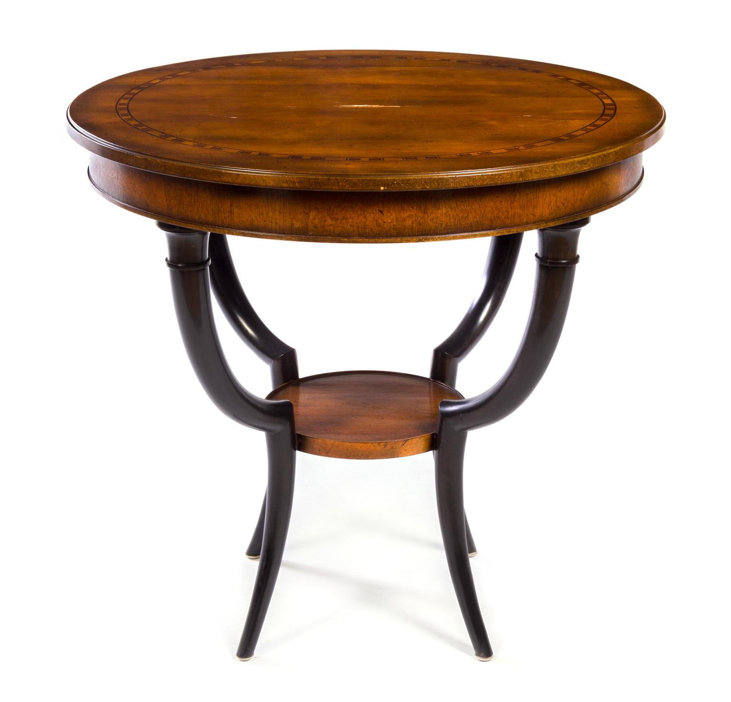 A Biedermeier Style Parcel Ebonized Hardwood Table Height 28 x diameter of top 30 1/2 inches. — BAKER FURNITURE, 20TH CENTURY