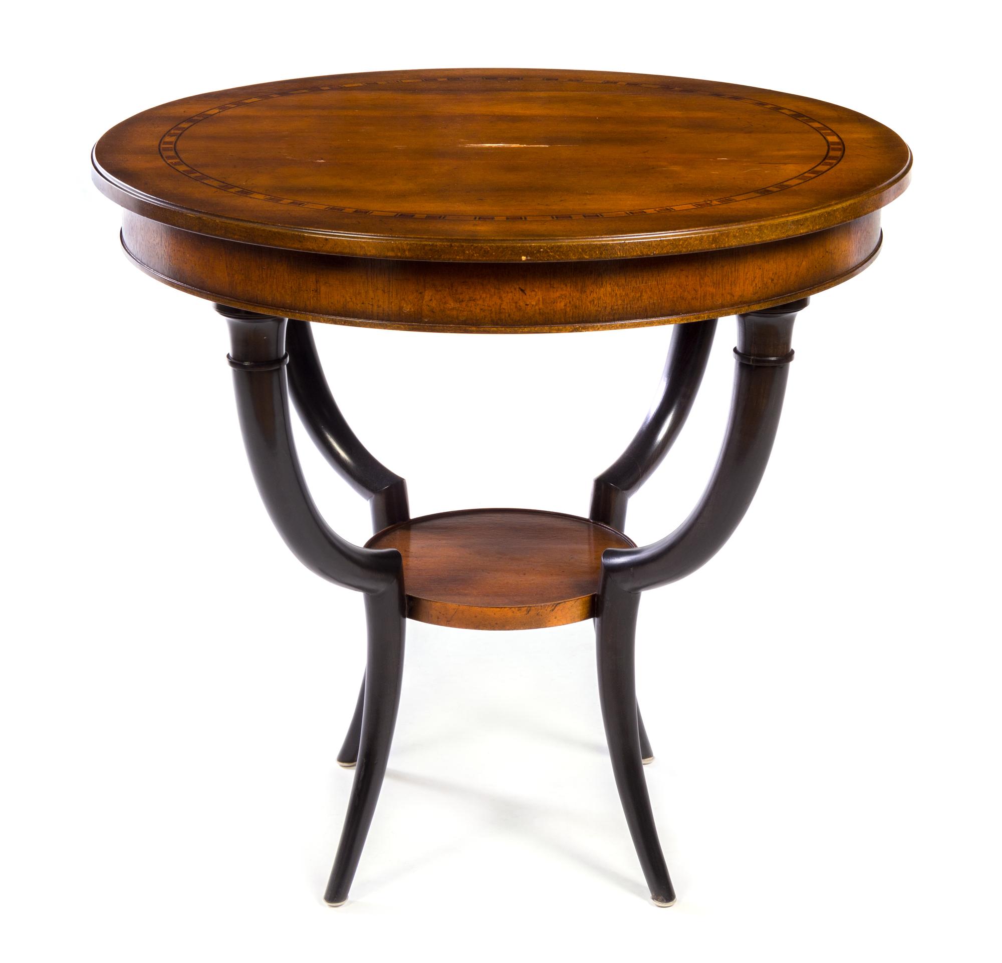 A Biedermeier Style Parcel Ebonized Hardwood Table Height 28 x diameter of top 30 1/2 inches. — BAKER FURNITURE, 20TH CENTURY