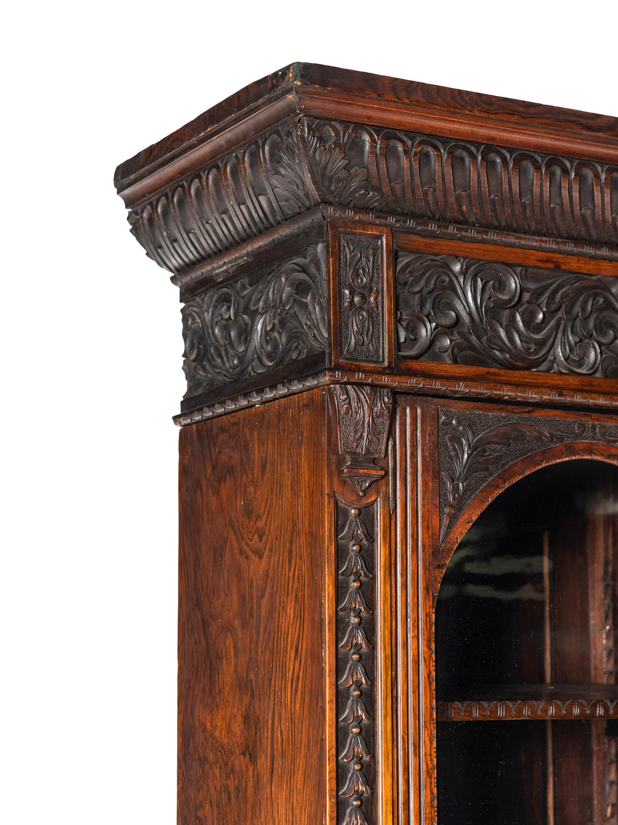 An Italian Rosewood and Carved Walnut Bookcase