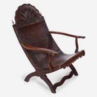 A carved mahogany and tooled leather Campeche chair Mexico, late 18th / early 19th century