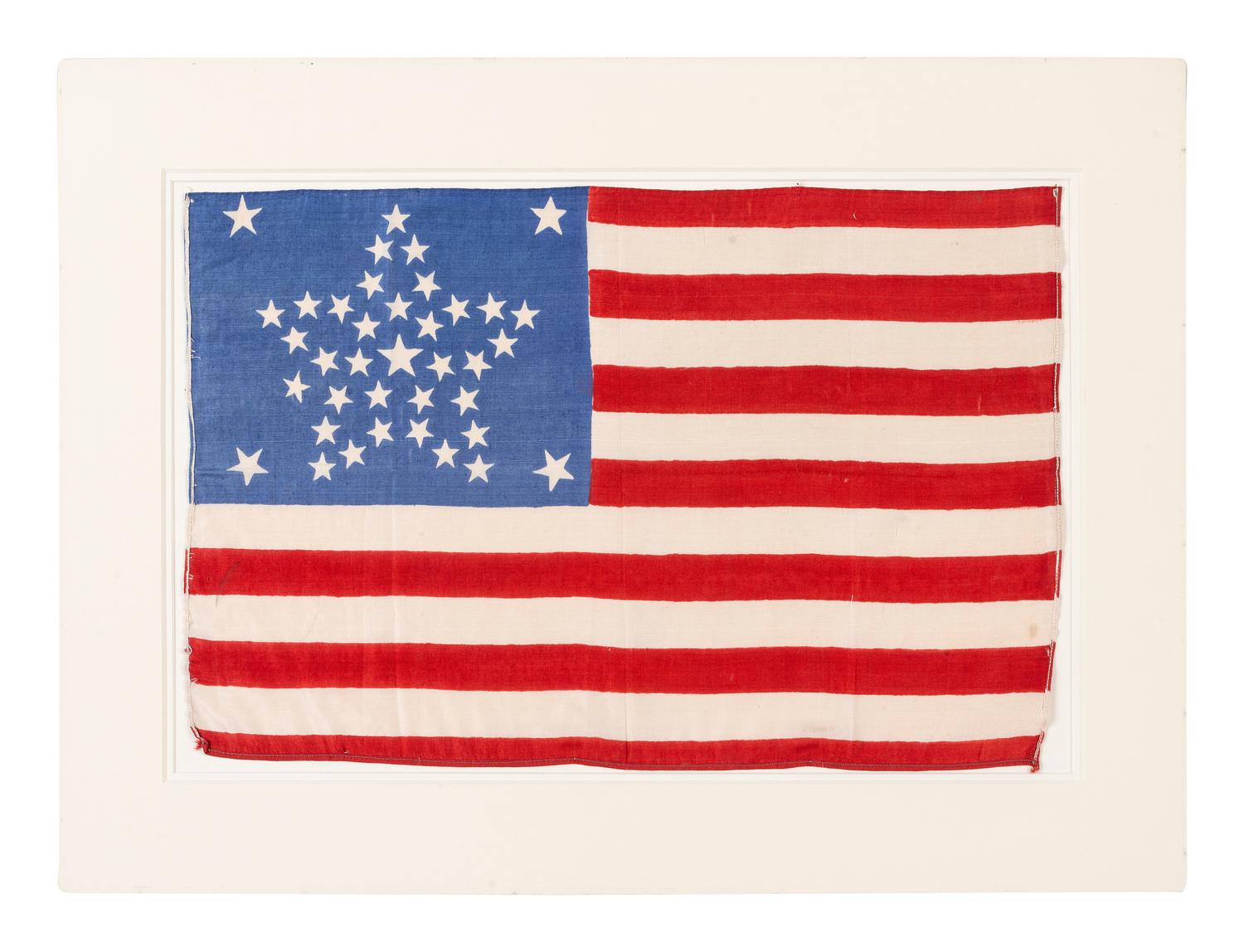 [FLAGS]. 38-star American parade flag with "Great Star" pattern. Ca 1877-1890.