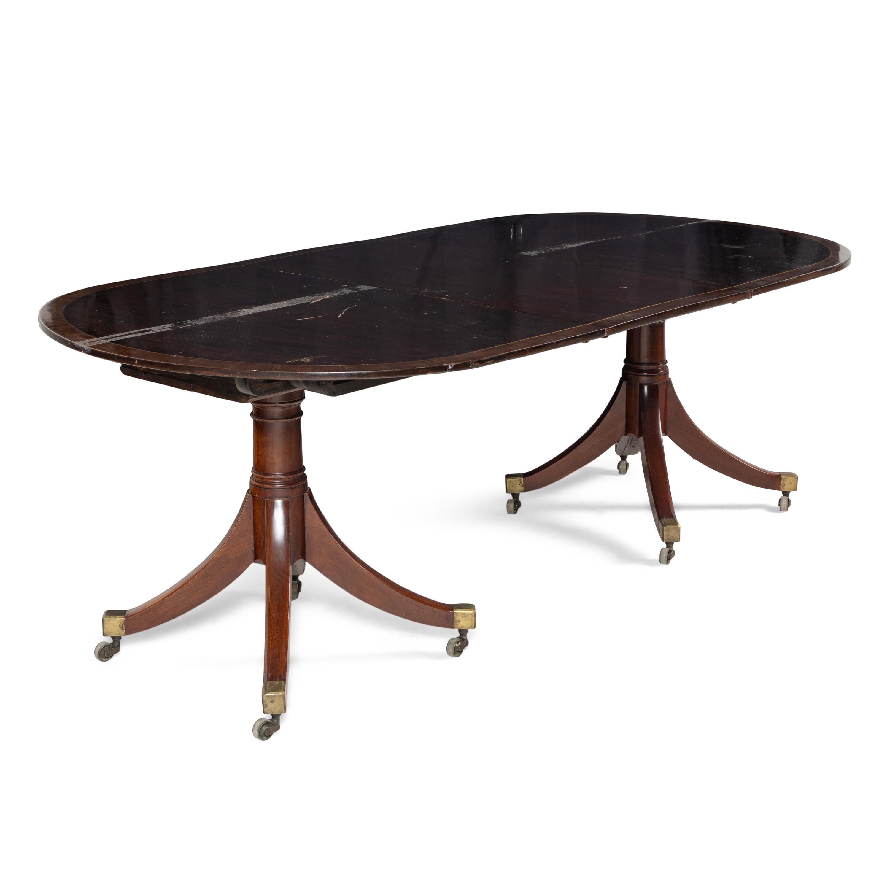 A George III Style Brass Inlaid Mahogany Dining Table