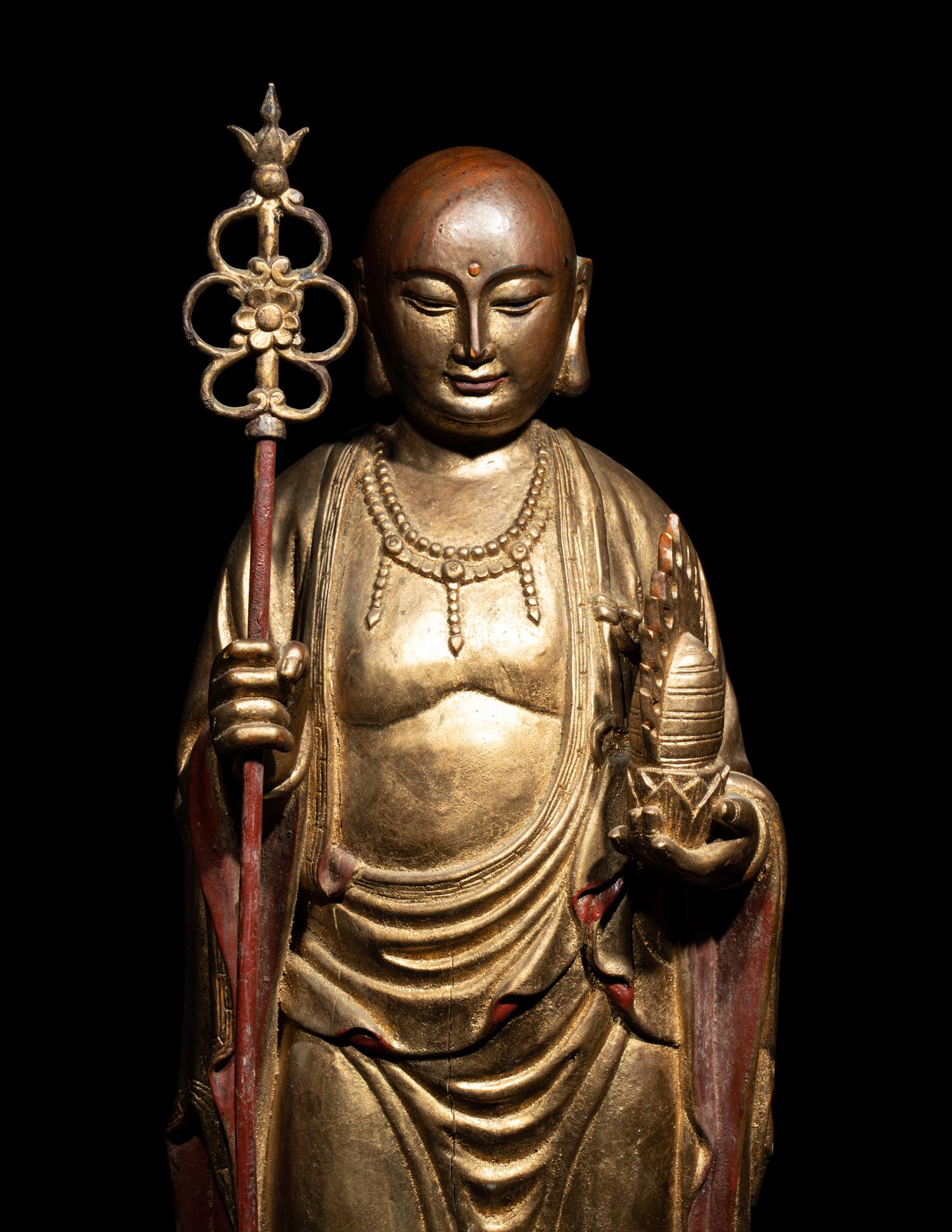 A Chinese Gilt and Lacquered Wood Figure of a Standing Monk