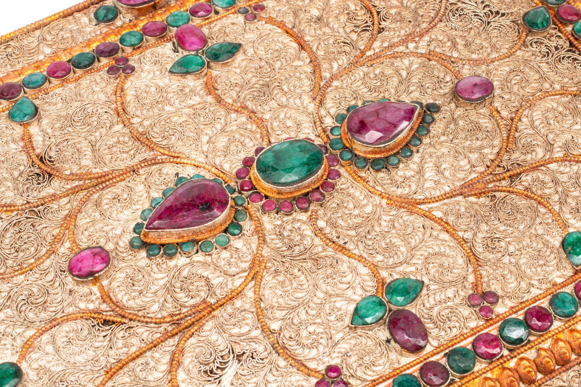 An Emerald and Ruby Mounted Silvered Metal Filigree Box