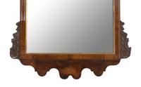 A George I Walnut and Parcel-Gilt Mirror