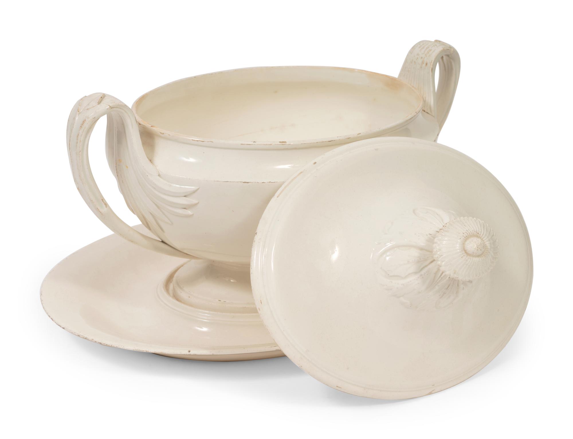 A French White Glazed Faïence Tureen and Underplate