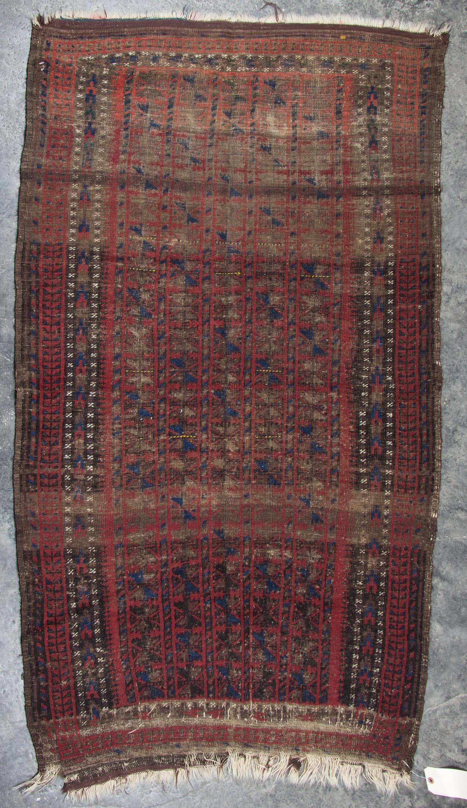 A Group of Three Rugs Largest 5 feet 10 inches x 3 feet 4 inches.